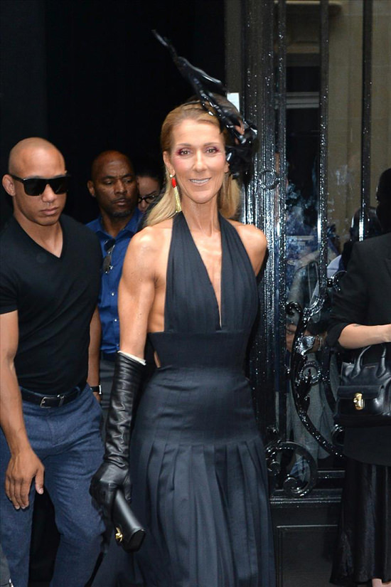 Celine Dion wears a black Schiaparelli halter dress with matching open-toe  booties