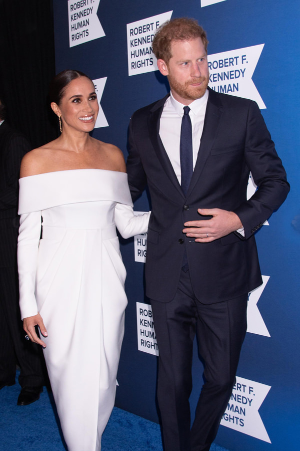 Meghan looks timeless in a white Louis Vuitton gown