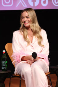 Style File: Margot Promotes BARBIE in Versace, Bottega Veneta and ...